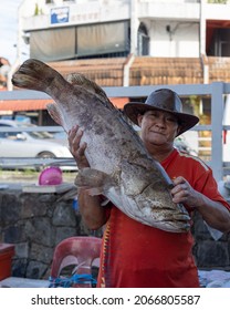 Kota Kinabalu, Sabah, Malaysia-August 7, 2021 : Portrait Image Of Unidentified Man Holding Big Catch Fish Smile At Camera