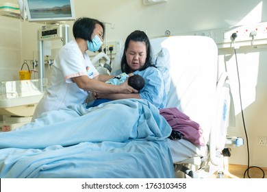 Kota Kinabalu, Sabah, Malaysia-May 30, 2020 : Midwife Helping Newborn Baby And Mother How To Breastfeeding On Labour Room Hospital Wad In Kota Kinabalu, Sabah, Malaysia