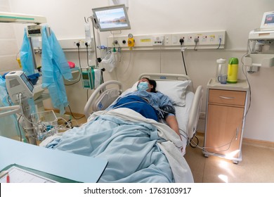 Kota Kinabalu, Sabah, Malaysia-May 30, 2020 : Young Asian Chinese Lady In Contraction Pain On Hospital Labour Room Ward Bed Waiting To Delivery Newborn Baby