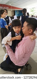 Kota Kinabalu, Sabah-Jan 2,2019: A Child Experiencing Separation Anxiety Clings To Her Father During First Day Of School. 