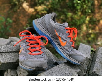 Kota Kinabalu, Sabah/Malaysia-September 6 2020 : Selective focus on image of used running shoes by Nike.Image may contain noise or grain due to low light.