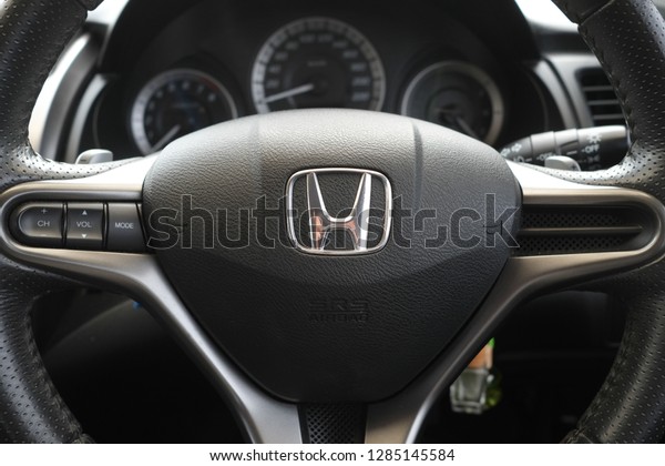 Kota Kinabalu,Sabah, MALAYSIA - JANUARY 15, 2019 :\
View of HONDA steering and meter. Focus on HONDA logo, Black\
Steering Wheel And Silver
