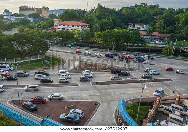 Kota Kinabalu,Sabah,Malaysia-July\
21,2017:Aerial view of street & cars in Kota\
Kinabalu,Sabah,Borneo,Malaysia.The increase in car ownership has\
created lack of parking space at the present\
scenario.