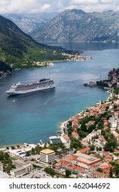 KOTOR, MONTENEGRO-CIRCA JUN, 2016: White Large Ferryboat Of MSC Cruises Swiss-registered Company Is On The Kotor Bay (Boka Kotorska). The MSC Orchestra Cruise Ship.