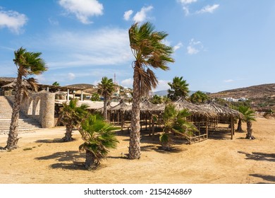 Koumbara beach with golden sand and palm trees on Ios Island. Greece