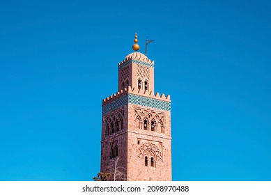 Koutoubia Mosque with traditional islamic ornament and decoration at minaret tower against clear blue sky