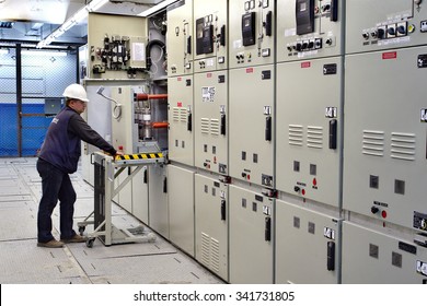 Kovdor, Murmansk region, Russia - September 3, 2007: Electrical Switchgear room of mining plant, Metal-Clad electrical cabinet, engineer control  Indoor High Voltage Vacuum DC Circuit Breaker.