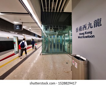 Kowloon, Hong Kong - JUL 2019: Passengers Are Preparing To Board A High-speed Train 