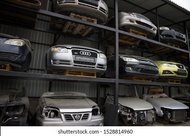 Kozani, Greece - September 2019: A Car Cemetery, With The Front Part Of Half Cut Vehicles. Awaiting Dismantling, Recycling Or Sale.