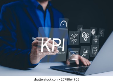 KPI, Analyzing Key Performance Indicators. Businessman use laptop to analyze key performance indicators (KPIs) with various graphs, work tools, charts, data analysis, and performance tracking.