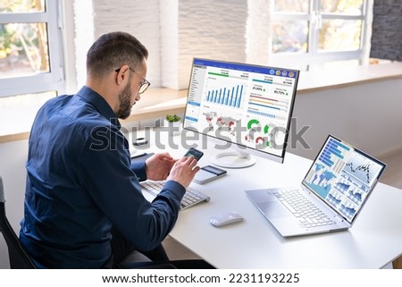 KPI Business Analytics Data Dashboard. Analyst Using Computer