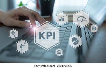 KPI concept. Key Performance Indicator using business intelligence metrics to measure achievement versus planned target. Working on  computer with"KPI" abbreviation, business goals and process icons.