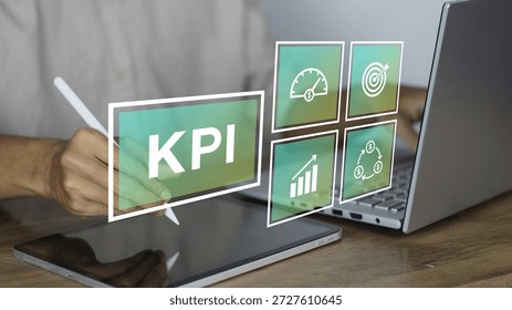 KPI (Key Performance Indicator) concept displayed on a digital tablet screen as a professional businessman uses a stylus to track business growth and financial performance. This high-quality conceptual image features digital icons representing a speedometer for efficiency, a target for goals, an upward trend for growth, and a dollar cycle for return on investment (ROI). The visual highlights the importance of data-driven decision-making, performance monitoring, and strategic planning in a modern corporate or startup environment. The background shows a laptop and a wooden desk, emphasizing a productive workspace