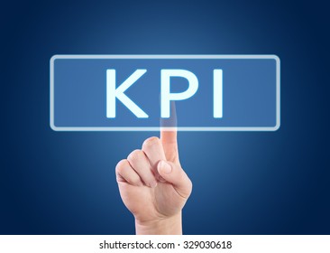 KPI - Key Performance Indicator - hand pressing button on interface with blue background.
