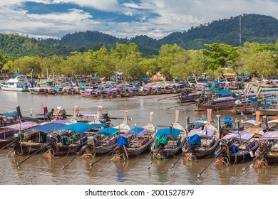 Krabi, Thailand - April 27 2017:
Line of traditional Thai wooden  long tail boat docked at Hat noppharat thara