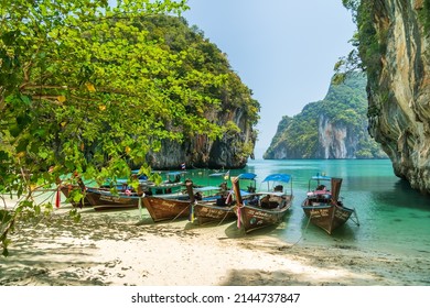 Krabi, Thailand - March 19, 2021: Lao Lading Island, famous travel destination, with tourist boats on beach.