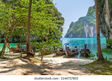 Krabi, Thailand - March 19, 2021: Lao Lading Island, famous travel destination, with tourist boats on beach.