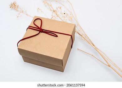 Kraft Gift Box With Red Bow Rope In Minimal Style