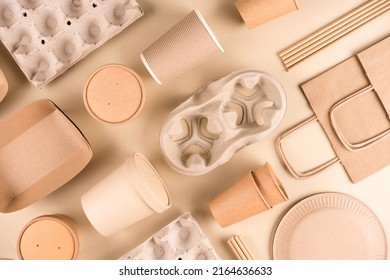 Kraft paper eco food packaging over light brown background. Street food sustainable paper packaging, recyclable paperware, zero waste packaging concept. Flat lay, mockup image. Paper utensils - Shutterstock ID 2164636633