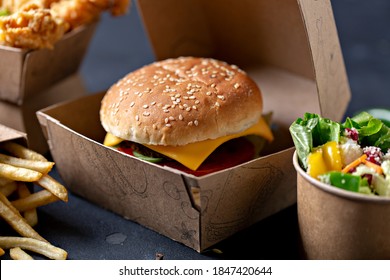 Kraft Paper Food Packaging Boxes For Burgers And  French Fries, Salad, Nagets. On A Black Background. - Image