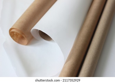 Kraft Paper Rolls On Office Desk. Design Concept. Creative Studio Space.