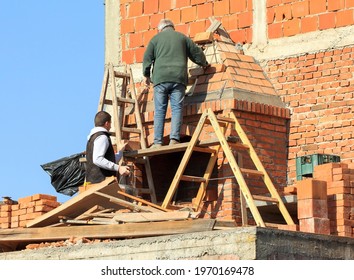 Kragujevac, Republic Of Serbia- March 2, 2102:Two Workers Building Masonry Fireplace.
