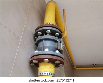 Kragujevac, Serbia, June 22, 2022 Yellow Gas Pipes With On And Off Lever, Gas Installation For Heating In A Residential Building