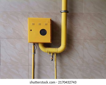 Kragujevac, Serbia, June 22, 2022 Yellow Gas Pipes With On And Off Lever, Gas Installation For Heating In A Residential Building