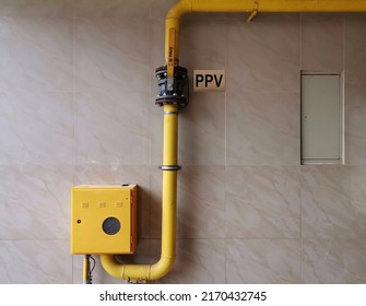 Kragujevac, Serbia, June 22, 2022 Yellow Gas Pipes With On And Off Lever, Gas Installation For Heating In A Residential Building