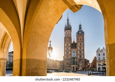 Krakow cloth hall and Saint Mary's Basilica on the main market square at sunrise in Cracow, Poland. Morning scene in the center of Krakow in Poland.