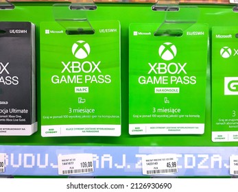 Krakow, Malopolska, Poland - February 2022: Microsoft Xbox Game Pass PC digital key prepaid gift card keys, set of many Xbox service subscription gift cards sold in a store, object closeup, nobody