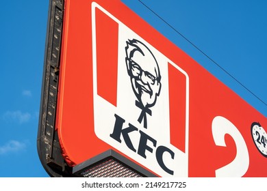 Krakow, Malopolska, Poland - May 2022: KFC Billboard Advertisement, Kentucky Fried Chicken Fast Food Restaurant Brand Emblem, Company Logo Detail, Closeup, Nobody, Outdoors Shot, No People