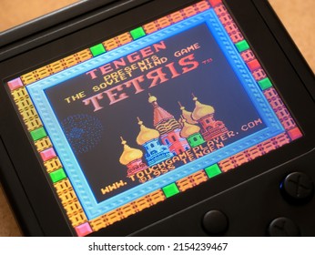 Krakow, Malopolska, Poland - May 2022: Famicom Tengen Tetris 1988 Original Classic Old Retro Vintage Video Game, Handheld Emulator Console Screen Display Macro, Extreme Closeup, Nobody, No People