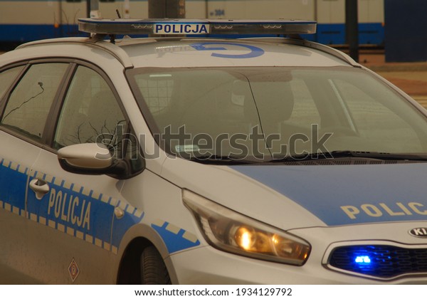 Krakow, Poland -\
03.11.2021: Traffic accident, intervention of Polish police and\
medical services. Police car and ambulance at the signal.\
Assistance to victims.