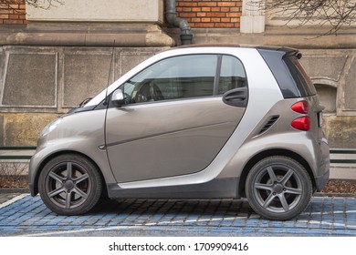 Krakow, Poland 19.02.2020: Small Gray City Car Smart Fortwo First Generation In A Parking Space For People With Disabilities. Urban Infrastructure For People With Disabilities. Side View.