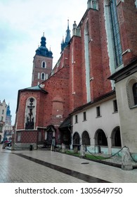 Krakow, Poland - 29.03.18: Side View Of St. Mary's Basilica - Our Lady Assumed Into Heaven - Brick Church,one Of The Best Examples Of Polish Gothic Architecture, And Commonly Noted In Top 10 Churches.