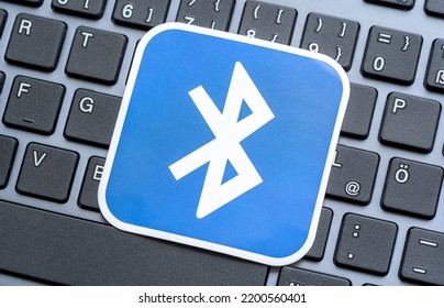 Krakow, Poland - August 2022: Bluetooth Technology Logo Symbol Card, Sticker, Label Laying On A Modern Laptop Computer Keyboard, Bluetooth Devices Support Concept, BT Connection, Nobody, No People