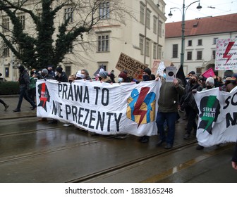 Krakow, P:oland - December 13 2020: Anti-government and Law and Justice demonstration support Women Strike, pro choice idea, on Krako city center, banner with symbols