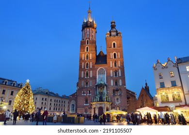 Krakow, Poland - December 2, 2021: Exterior Of The Basilica Of Saint Mary, Brick Gothic Church Located On Main Market Square In Krakow. Saint Mary's Basilica Is Example Of Polish Gothic Architecture