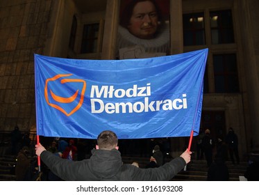 Krakow, Poland - February 12 2021: Banner Of Young Democrats And Party Logo Hold By Man During Public Anti-government Demonstration In Poland