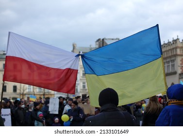 Krakow, Poland - February 27 2022: Flag of Ukraine and Poland tied together during public demonstration to support Ukraine against Russian aggression