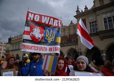Krakow, Poland - February 27 2022: people from Belarus with original flag of their country and banner support Ukraine and protest against Russian aggression