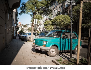 Krakow, Poland - June 12th 2019 Classic Fiat 126 vintage small car parked on sunny residential street scene replacement for Fiat 500