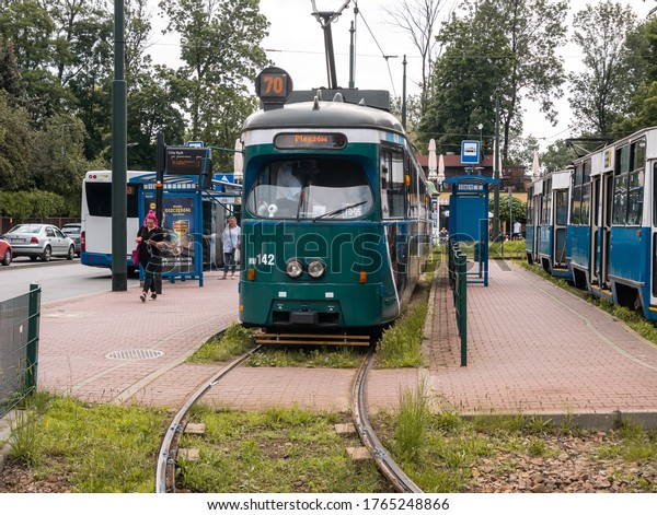 KRAKOW, POLAND - JUNE 25, 2020: E1 type classic\
tram at the Cichy Kacik stop in Krakow, Poland. MPK Krakow Public\
Transport tramway.