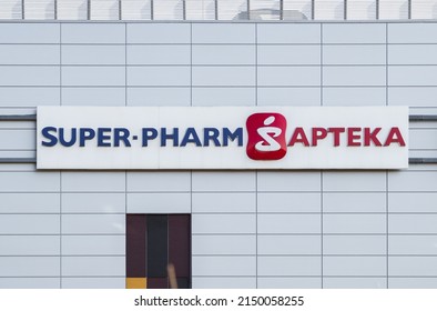 KRAKOW, POLAND - MARCH 21, 2022: Super-Pharm Israeli multinational pharmacy chain company. Signboard with brand logotype.