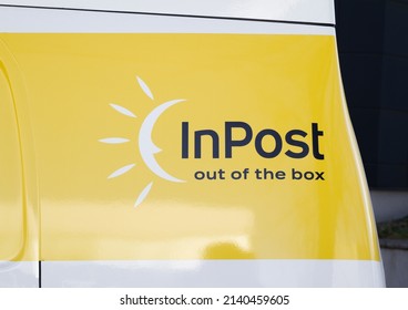 KRAKOW, POLAND - MARCH 27, 2022: InPost Logo On The Side Of Nissan E-NV200 Car, Electric Delivery Truck. Zero-emission Cargo Van Fleet - Logistics Courier Company And Mail, Package Service.