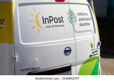 KRAKOW, POLAND - MARCH 27, 2022: InPost Logo On Nissan E-NV200 Car, Electric Delivery Truck. Zero-emission Cargo Van Fleet - Logistics Courier Company And Mail, Package Service.