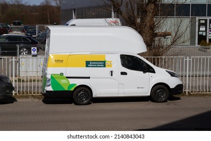 KRAKOW, POLAND - MARCH 27, 2022: Nissan E-NV200 Car, Electric Delivery Truck. Zero-emission Cargo Van In InPost Fleet - Logistics Courier Company And Mail, Package Service.