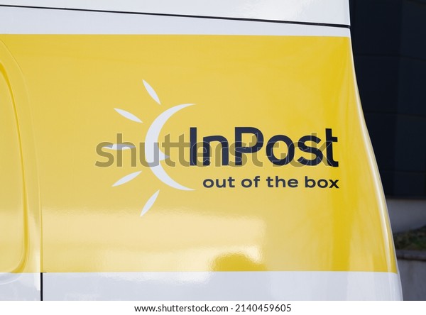 KRAKOW, POLAND - MARCH 27, 2022: InPost logo on\
the side of Nissan e-NV200 car, electric delivery truck.\
Zero-emission cargo van fleet - logistics courier company and mail,\
package service.