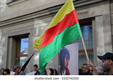 Krakow / Poland - October 12 2019: Flag Of  Autonomous Administration Of North And East Syria, Named Rojava Also, Holds By Protester During Demonstration Against Turkish Invasion In Syria, In Krakow